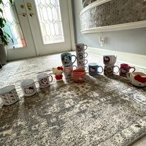 Full hello kitty set comes with 13 mugs, 2 bowls, and a vintage hello kitty!!